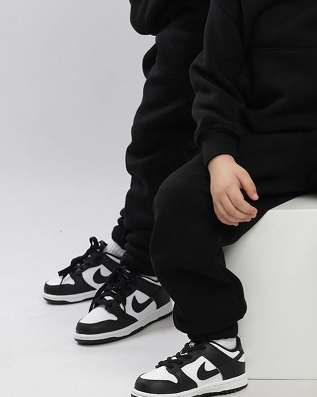 Black and white nikes kids hot sale